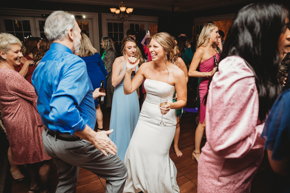 Wedding reception dancing, laughter, and celebration at Reflection Images by Tracy Rowell in Florence SC