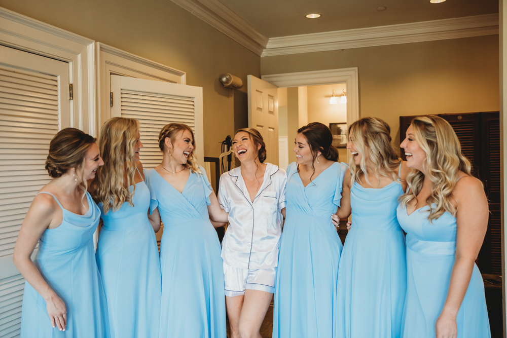 Bridal party group photo with fashionable gowns and suits at Reflection Images by Tracy Rowell in Florence SC