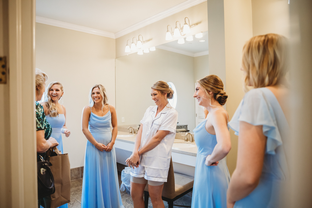 Bridal party group photo with fashionable gowns and suits at Reflection Images by Tracy Rowell in Florence SC