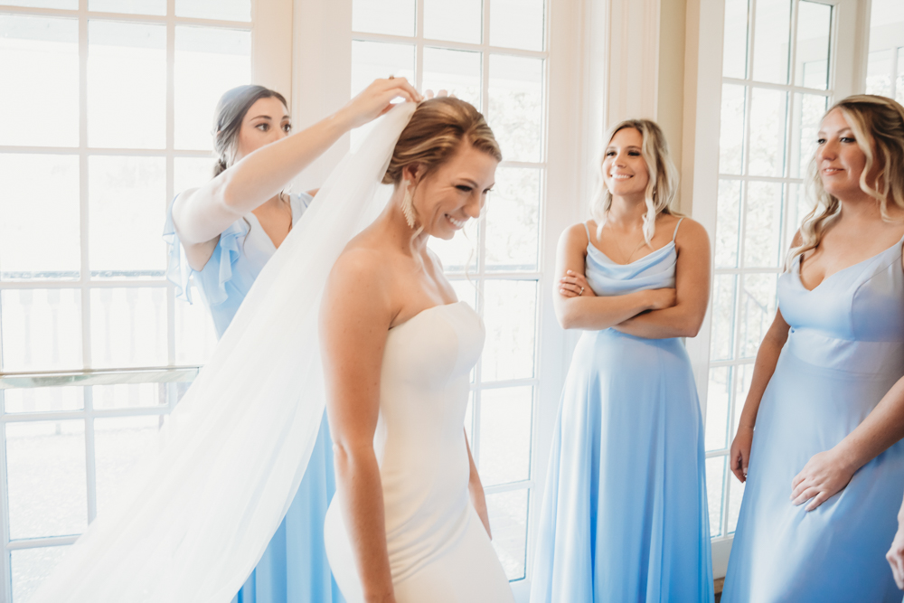 Bridal party group photo with fashionable gowns and suits at Reflection Images by Tracy Rowell in Florence SC
