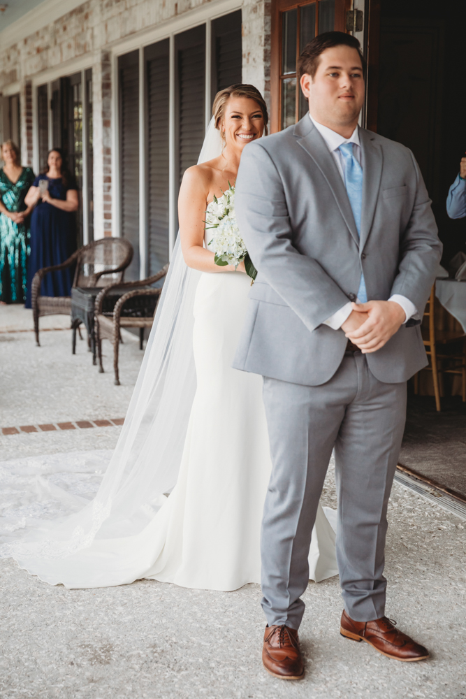 Bride and groom sharing emotional first look before ceremony at Reflection Images by Tracy Rowell in Florence SC