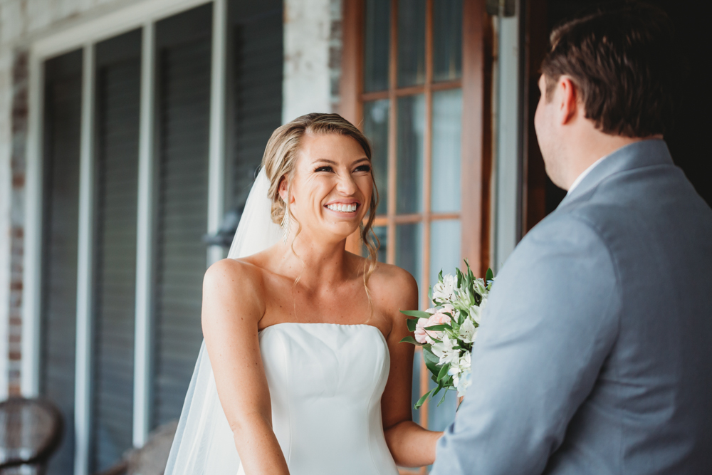 Bride and groom sharing emotional first look before ceremony at Reflection Images by Tracy Rowell in Florence SC
