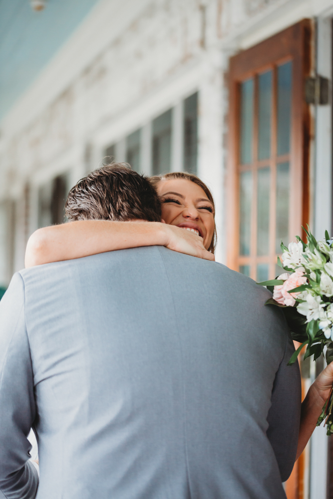 Bride and groom sharing emotional first look before ceremony at Reflection Images by Tracy Rowell in Florence SC