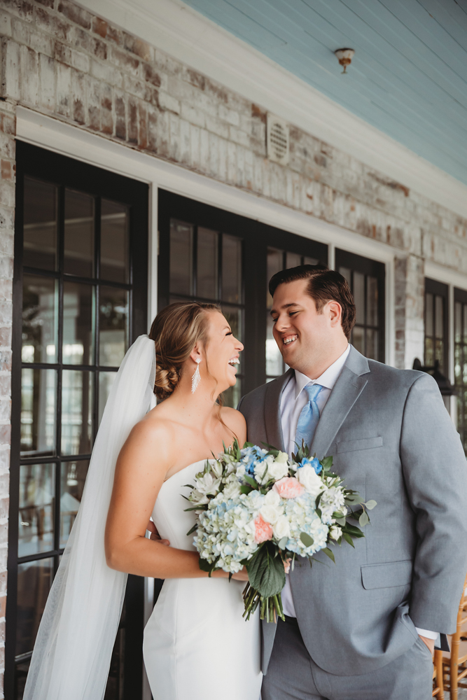 Bride and groom sharing emotional first look before ceremony at Reflection Images by Tracy Rowell in Florence SC