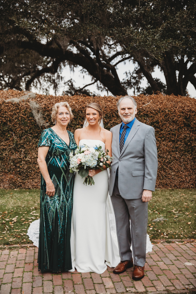 Family group portrait with joyful smiles and classic styling at Reflection Images by Tracy Rowell in Florence SC