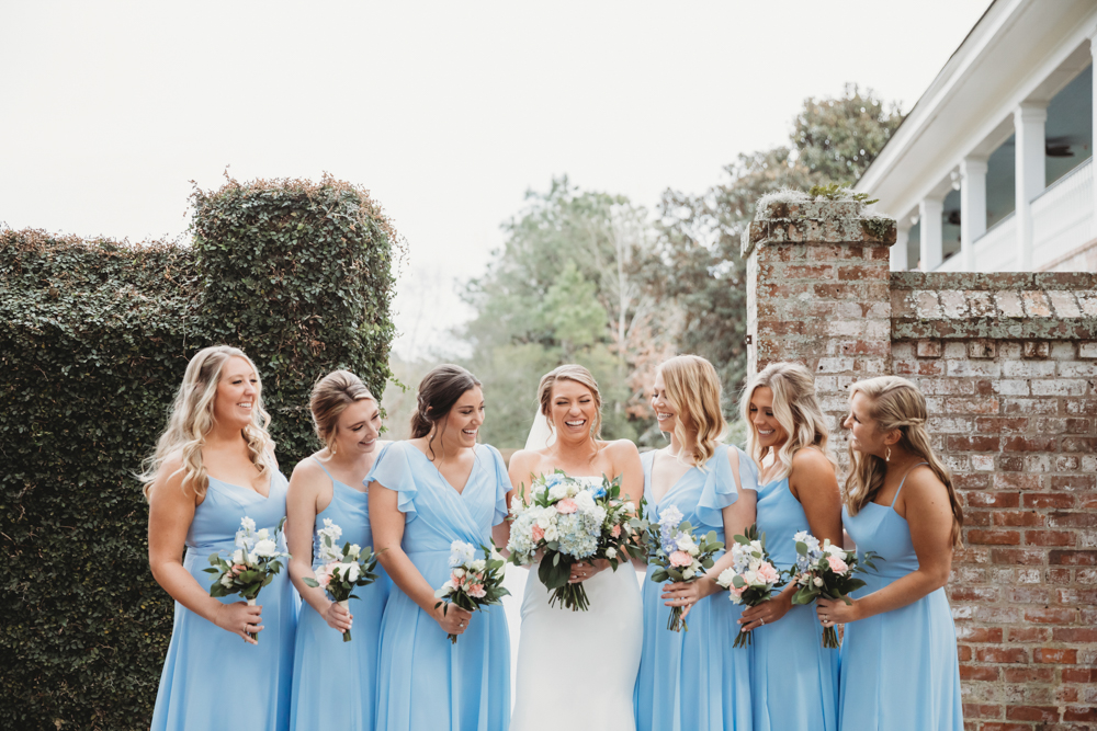 Bridal party group photo with fashionable gowns and suits at Reflection Images by Tracy Rowell in Florence SC