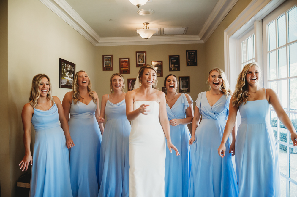 Bridal party group photo with fashionable gowns and suits at Reflection Images by Tracy Rowell in Florence SC