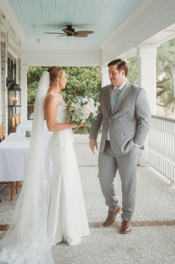 Bride and groom sharing emotional first look before ceremony at Reflection Images by Tracy Rowell in Florence SC