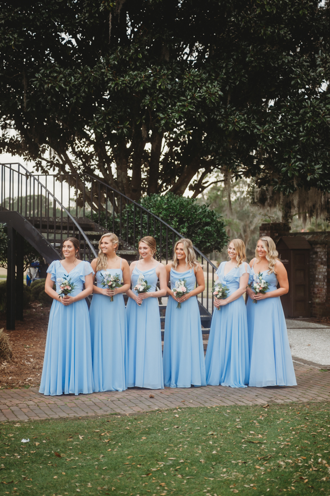 Bridal party group photo with fashionable gowns and suits at Reflection Images by Tracy Rowell in Florence SC