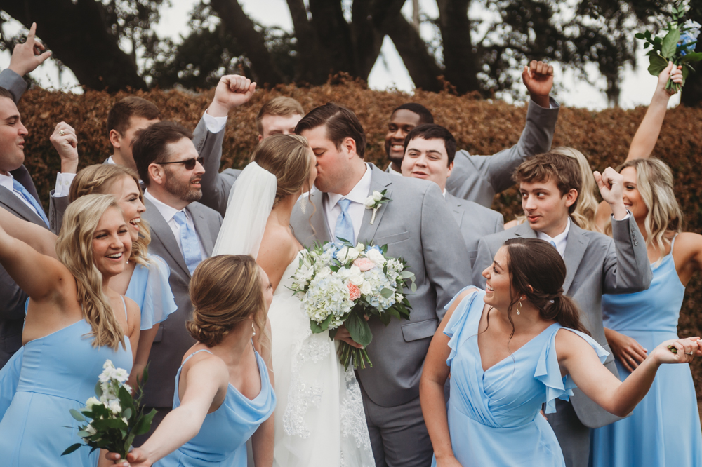 Groomsmen group portrait in coordinated suits with camaraderie at Reflection Images by Tracy Rowell in Florence SC