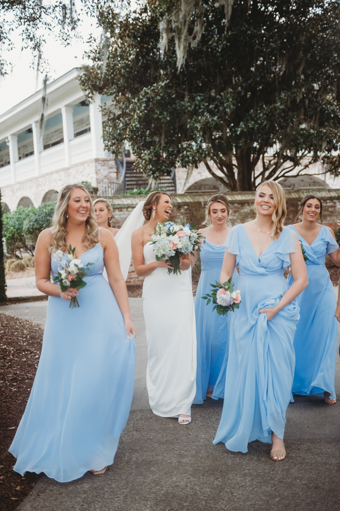Bridal party group photo with fashionable gowns and suits at Reflection Images by Tracy Rowell in Florence SC