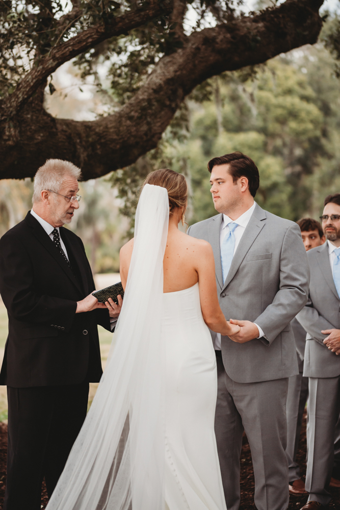 Wedding ceremony with vows and emotional moments on scenic Daniel Island at Reflection Images by Tracy Rowell in Florence SC