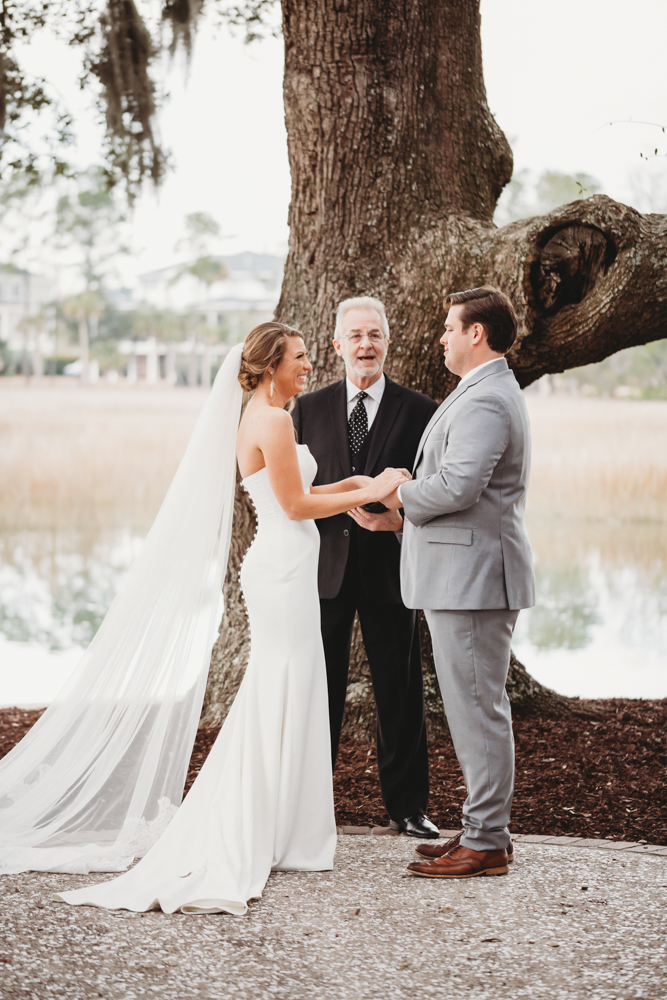 Wedding ceremony with vows and emotional moments on scenic Daniel Island at Reflection Images by Tracy Rowell in Florence SC