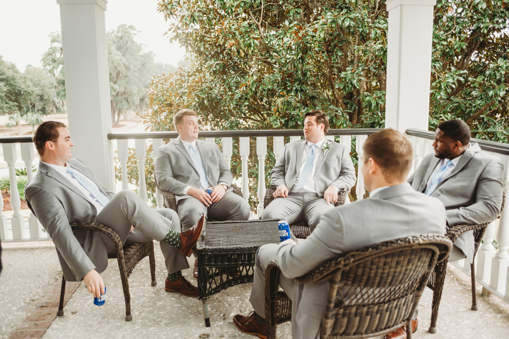 Groomsmen group portrait in coordinated suits with camaraderie at Reflection Images by Tracy Rowell in Florence SC