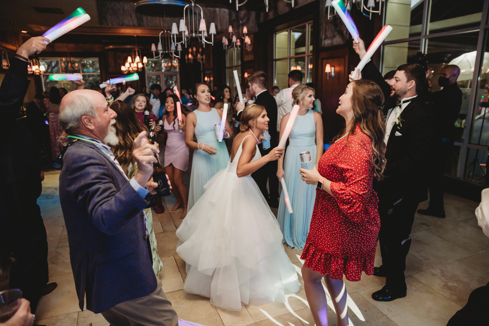 Wedding moment during ring exchange, captured by reflection images by tracy rowell.