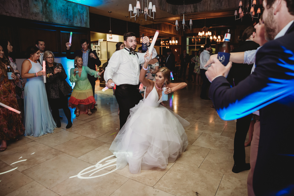 Wedding moment during bouquet toss, captured by wedding.