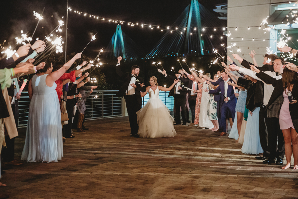 Wedding moment couple during sparkler exit, captured by tracy rowell.