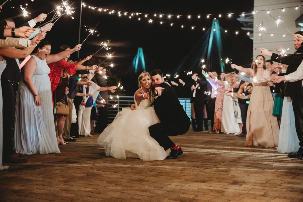 Wedding moment couple during sparkler exit, captured by tracy rowell.