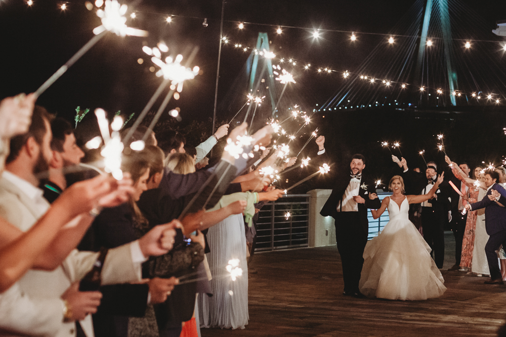 Wedding moment couple during sparkler exit, captured by tracy rowell.