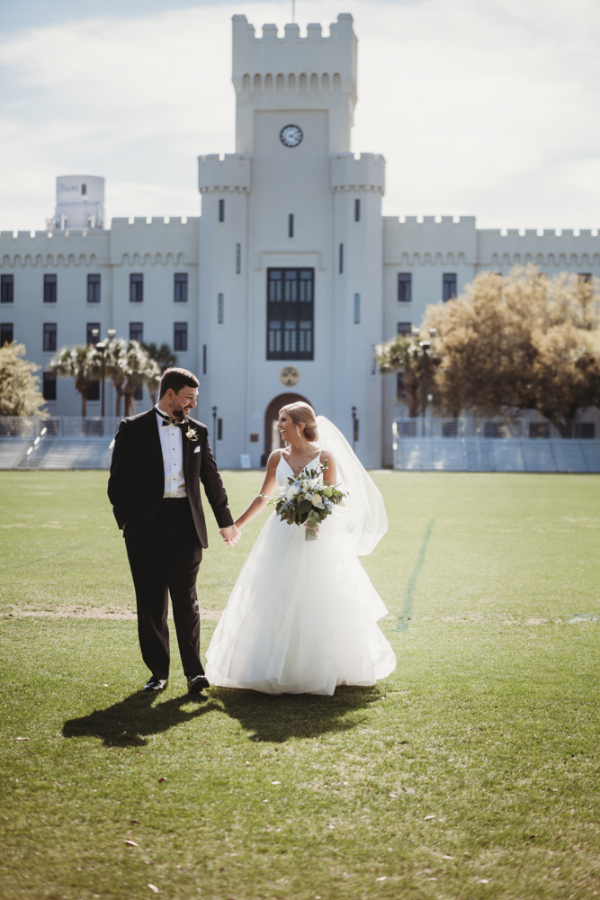 Wedding moment during bridal portraits, captured at the citadel charleston sc wedding.