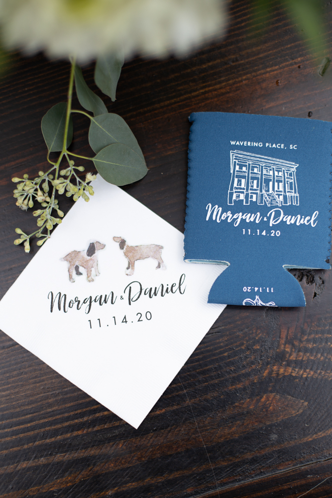 Close-up of a custom wedding koozie and napkin featuring Morgan and Daniel’s names and wedding date