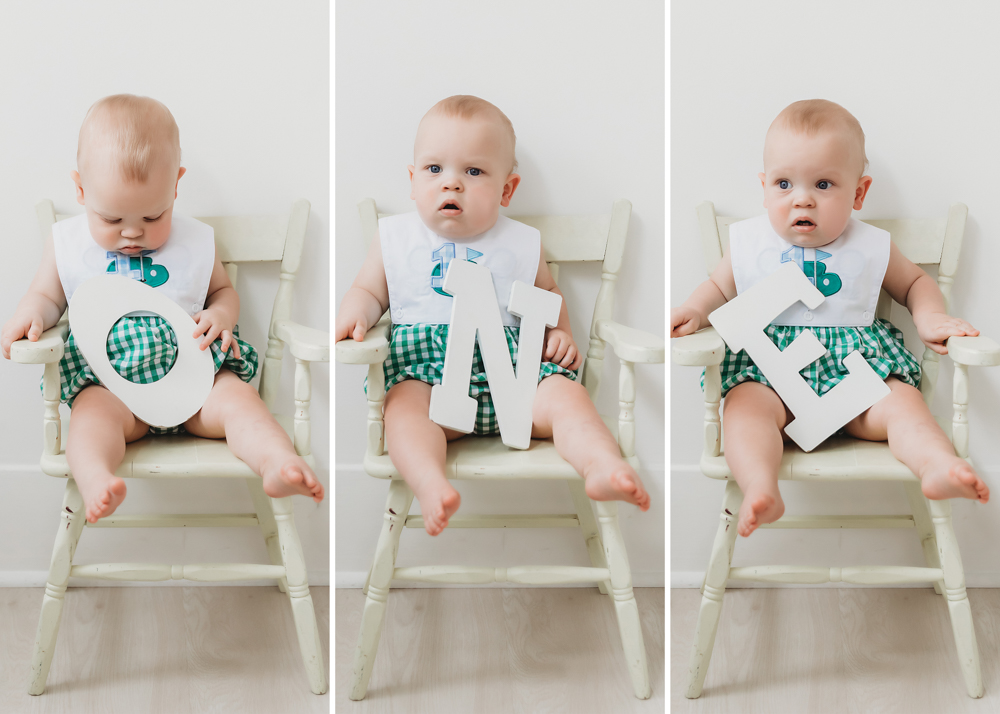 Calm twin holding letter 'O' on a white chair in a composite spelling ONE at Reflection Images by Tracy Rowell in Florence SC