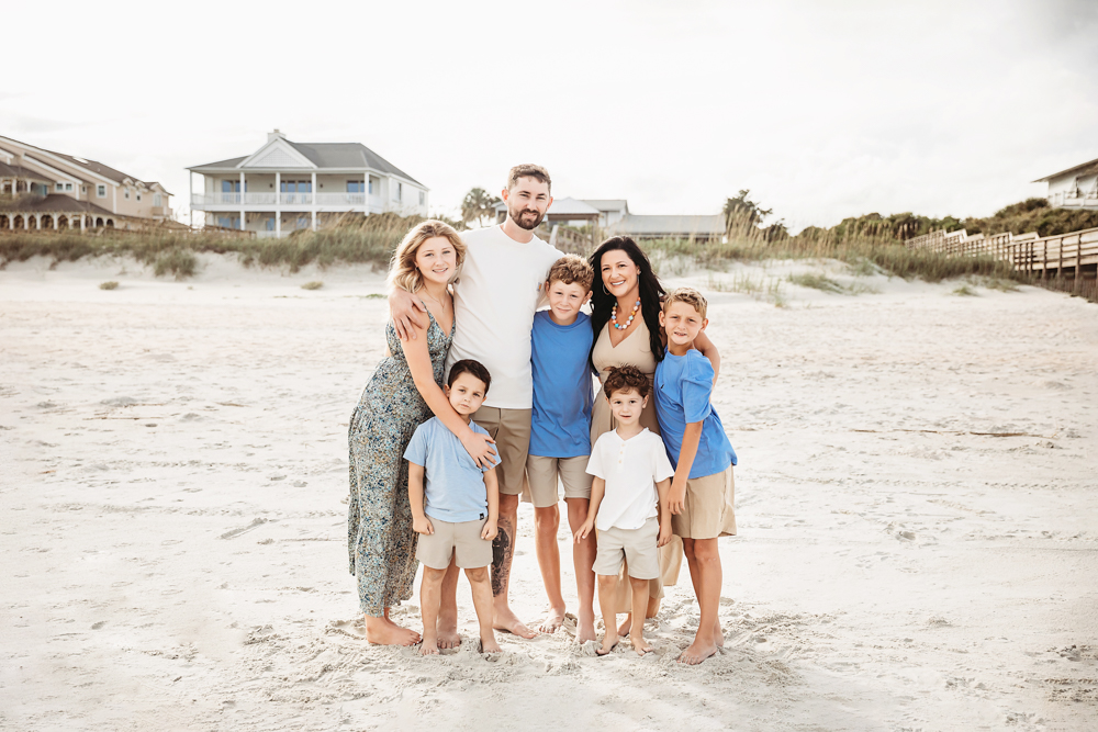 Culpepper family beach photography in Pawleys Island SC featuring blue and ivory coordinated outfits on sandy dunes.