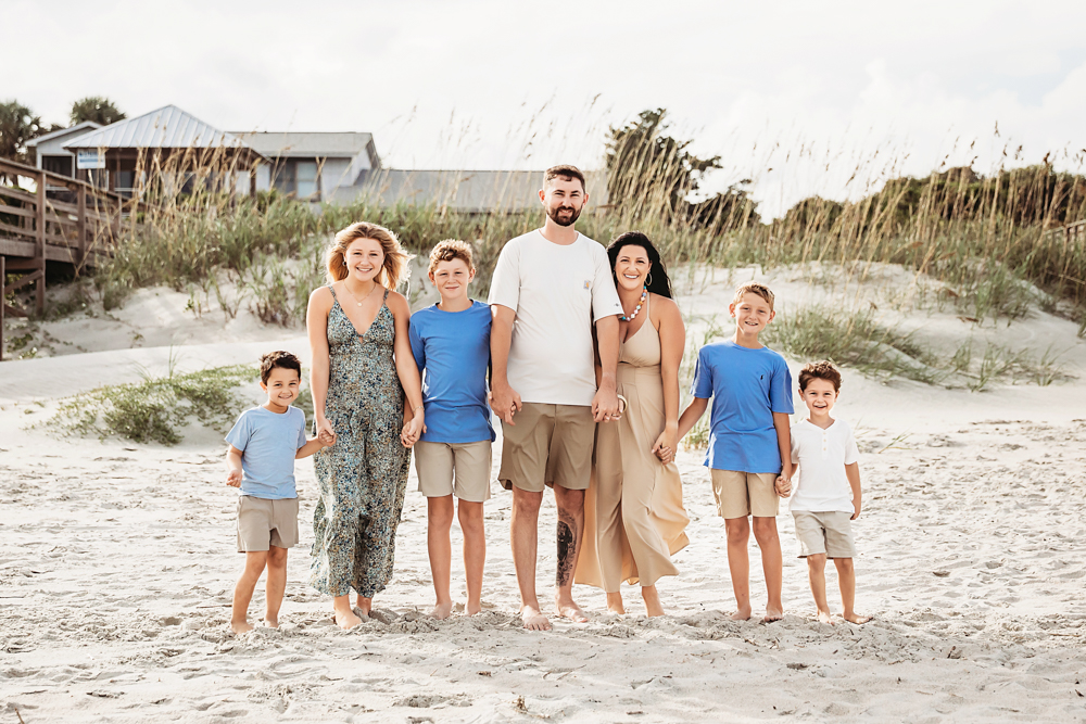Culpepper family in Pawleys Island SC, posing in sage and blue beach outfits, a professional outdoor family session.