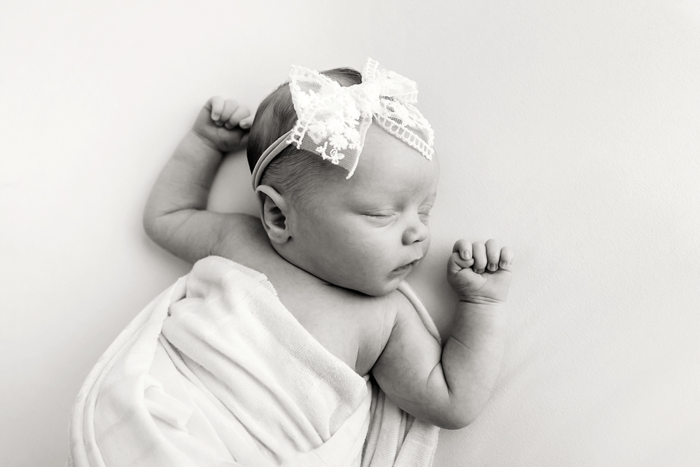 black and white newborn natural posing sleeping newborn