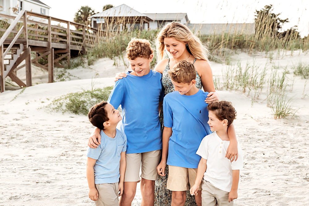 sister and four brothers posed on the beach at sunset Pawleys Island SC beach for family photography.