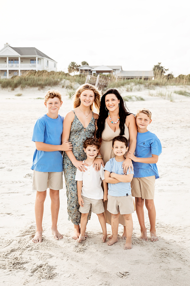 Family in blue, taupe, and floral on Pawleys Island SC beach. Professional beach family photographer captured Culpepper...